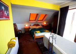 a bedroom with a bed and a bath tub at Sona Baile Home Stay in Dooagh +156 photos