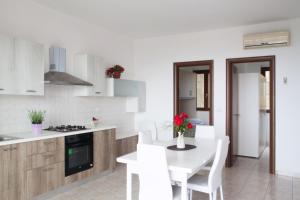 Kuchyňa alebo kuchynka v ubytovaní Airone Residence