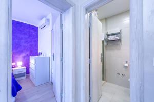 a room with a bathroom with a sink and a refrigerator at Apartment Tonka in Cavtat