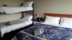 Postel nebo postele na pokoji v ubytování Executive Home + 17 fotografií