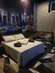 a bedroom with a large bed with a view of a city at Foresterie Lombarde B&B Villa Ambra in Limbiate