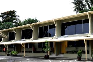 an external view of a building with windows at Huon Gulf Hotel in Lae
