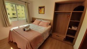 Postel nebo postele na pokoji v ubytování Apt 104 - Apartamento em Ilhéus próxima à praia dos milionários + 44 fotografií