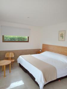 En eller flere senge i et værelse på Chacras de Sierra