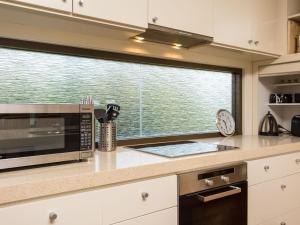 A kitchen or kitchenette at 'Rolling Waves 2' on Ocean Drive