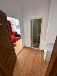 an open door to a room with a living room at Oriana in Constanţa