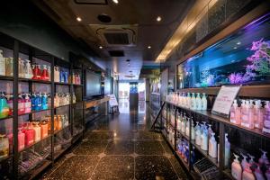 a store filled with lots of bottles of alcohol at Water Hotel Mw (Love Hotel) in Saitama