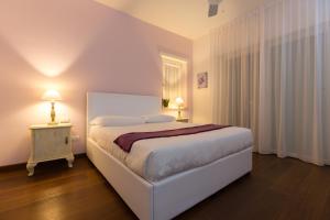 Postel nebo postele na pokoji v ubytování B&B Terra del Sole