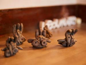 a group of small animal figurines on a table at Kikusui Ryokan in Tamano