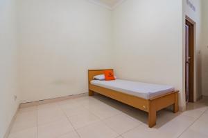 מיטה או מיטות בחדר ב-Koolkost near Riau Junction Mall (Minimum Stay 6 Nights)