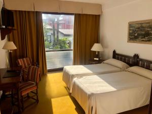 Un pat sau paturi într-o cameră la El Ancla