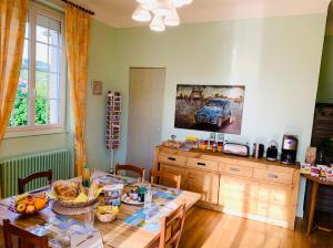 a kitchen with a table with food on it at Domaine des Ondes in Millau