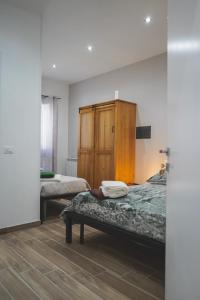 Postel nebo postele na pokoji v ubytování Ulivo Design b&b