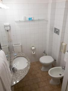 a bathroom with a sink and a toilet at Hotel Santa Maria in Chiavari