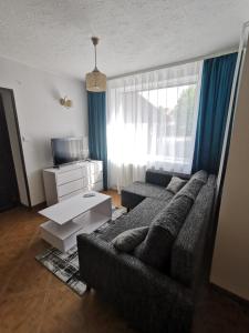 Postel nebo postele na pokoji v ubytování Apartament Ogrodowa