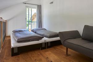 Säng eller sängar i ett rum på Ferienwohnungen am Lochbach