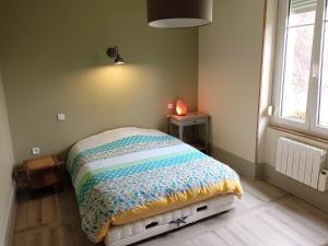 Postel nebo postele na pokoji v ubytování Superbe logement dans une maison de caractère