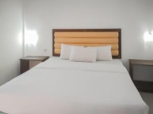 Кровать или кровати в номере RedDoorz Syariah near Sunrise Park Pangandaran