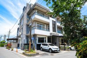 a car parked in front of a building at Caspia in Wujie