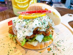 a sandwich on a bun on a table at Hotel & Resort Kiyomizu Bozanso in Yamanouchi