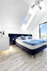 Katil atau katil-katil dalam bilik di Domki Nord Star