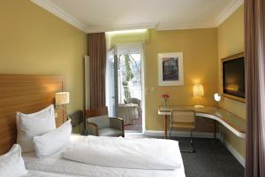 Een bed of bedden in een kamer bij Hotel Kleiner Riesen