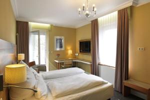 Postel nebo postele na pokoji v ubytování Hotel Kleiner Riesen