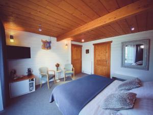 Postel nebo postele na pokoji v ubytování Nîdwazô - Ecolodge & Maison d'hôtes