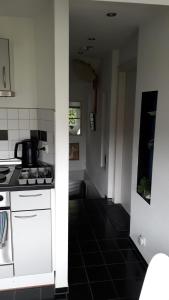 a kitchen with a stove and a counter top at Ferienwohnung CHRIS in Konstanz