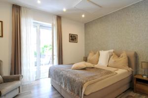Posteľ alebo postele v izbe v ubytovaní Silver Beach Apartments