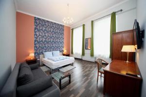 Televízia a/alebo spoločenská miestnosť v ubytovaní Cherry Apartman