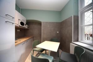 Kuchyňa alebo kuchynka v ubytovaní Cherry Apartman