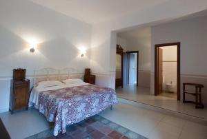 Ένα ή περισσότερα κρεβάτια σε δωμάτιο στο Masseria Agriturismo Moschella