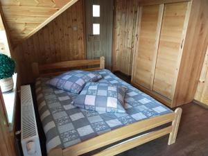 Postel nebo postele na pokoji v ubytování Wzgórze Baranów