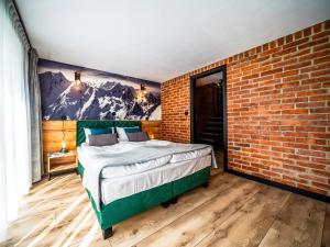 Posteľ alebo postele v izbe v ubytovaní Apartamenty Tatrzańskie Doliny