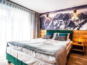 Posteľ alebo postele v izbe v ubytovaní Apartamenty Tatrzańskie Doliny