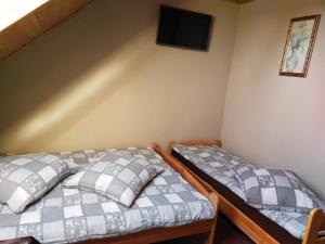 Postel nebo postele na pokoji v ubytování Wzgórze Baranów