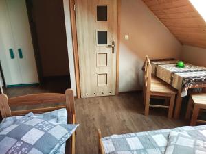 Postel nebo postele na pokoji v ubytování Wzgórze Baranów