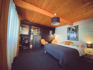 Postel nebo postele na pokoji v ubytování Nîdwazô - Ecolodge & Maison d'hôtes + 36 fotografií