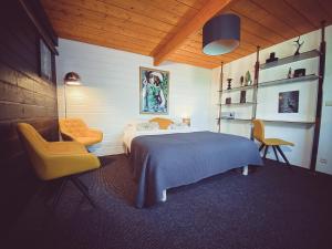 Postel nebo postele na pokoji v ubytování Nîdwazô - Ecolodge & Maison d'hôtes