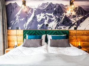 Posteľ alebo postele v izbe v ubytovaní Apartamenty Tatrzańskie Doliny