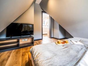 Posteľ alebo postele v izbe v ubytovaní Apartamenty Tatrzańskie Doliny