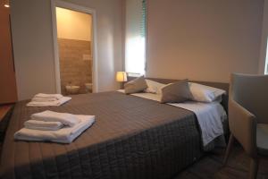 A bed or beds in a room at Dimora Risveglio