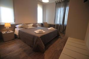 A bed or beds in a room at Dimora Risveglio