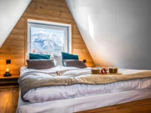 Posteľ alebo postele v izbe v ubytovaní Apartamenty Tatrzańskie Doliny