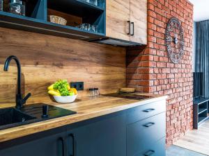 Kuchyňa alebo kuchynka v ubytovaní Apartamenty Tatrzańskie Doliny