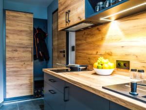 Kuchyňa alebo kuchynka v ubytovaní Apartamenty Tatrzańskie Doliny