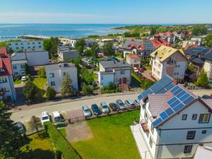 an aerial view of a small town with cars parked at Konik Morski in Jastarnia