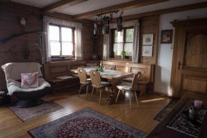 a dining room with a table and chairs at Almhaus Anita in Rieding