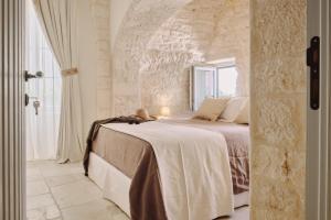 Ein Bett oder Betten in einem Zimmer der Unterkunft 1783 Dimora d'Epoca